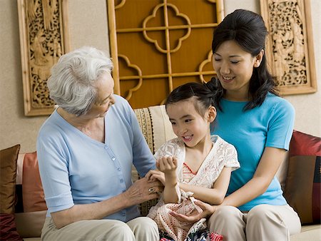 simsearch:640-01601434,k - Grandmother with mother and daughter smiling Stock Photo - Premium Royalty-Free, Code: 640-02775124