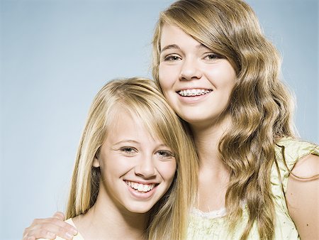 simsearch:640-01601334,k - Two girls embracing and smiling Stock Photo - Premium Royalty-Free, Code: 640-02775308
