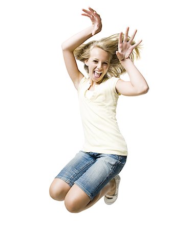 Girl smiling and leaping with hand up Stock Photo - Premium Royalty-Free, Code: 640-02775317