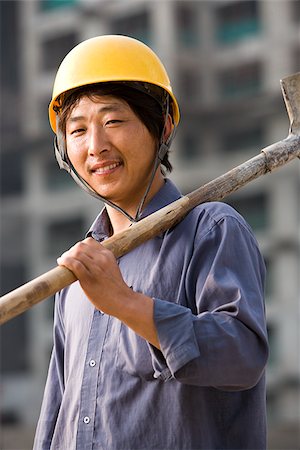 simsearch:640-03265269,k - Construction worker outdoors with helmet smiling Foto de stock - Sin royalties Premium, Código: 640-02775499