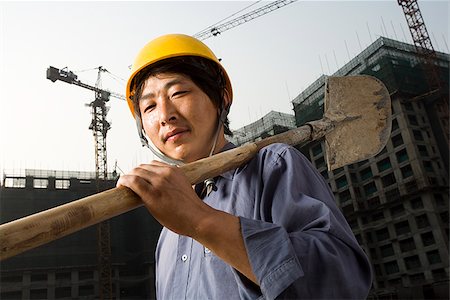 paletta - Construction worker outdoors with helmet smiling Fotografie stock - Premium Royalty-Free, Codice: 640-02775501