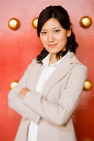 simsearch:640-01645712,k - Businesswoman standing with arms crossed smiling Stock Photo - Premium Royalty-Free, Code: 640-02775775