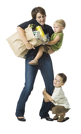 family adult children busy - Busy Mom with baby and small child. Stock Photo - Premium Royalty-Free, Code: 640-02775975