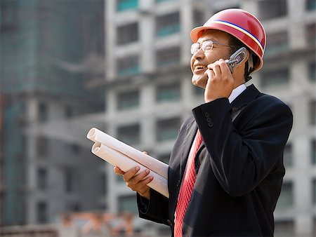 Architect on the job site. Stock Photo - Premium Royalty-Free, Code: 640-02776035