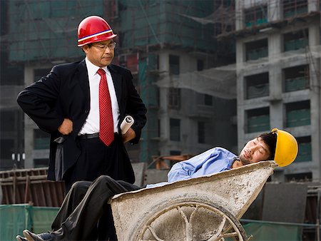 Architect on the job site with a worker. Stock Photo - Premium Royalty-Free, Code: 640-02776050