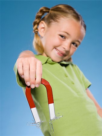 simsearch:640-02776114,k - Child holding a magnet. Stock Photo - Premium Royalty-Free, Code: 640-02776105