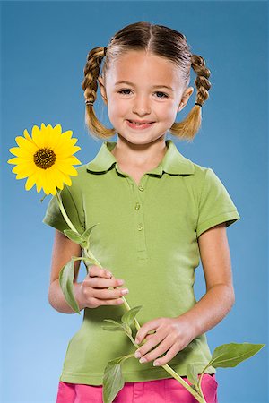 simsearch:640-02776114,k - Child holding a flower. Stock Photo - Premium Royalty-Free, Code: 640-02776115