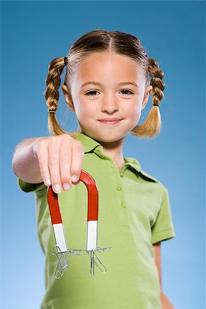 simsearch:640-02776114,k - Child holding a magnet. Stock Photo - Premium Royalty-Free, Code: 640-02776110