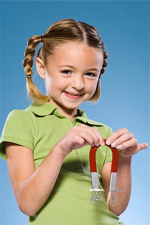 simsearch:640-02776114,k - Child holding a magnet. Stock Photo - Premium Royalty-Free, Code: 640-02776112