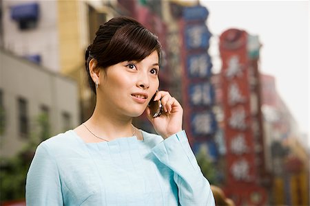 simsearch:640-02949616,k - Woman with a cell phone. Foto de stock - Royalty Free Premium, Número: 640-02776154