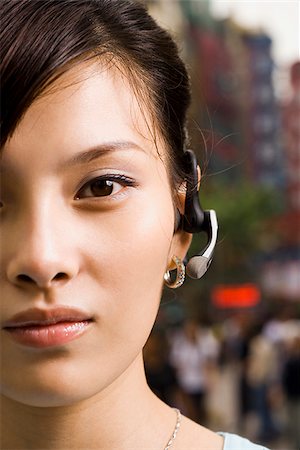 simsearch:640-02949616,k - Woman with a cell phone earpiece. Foto de stock - Royalty Free Premium, Número: 640-02776165