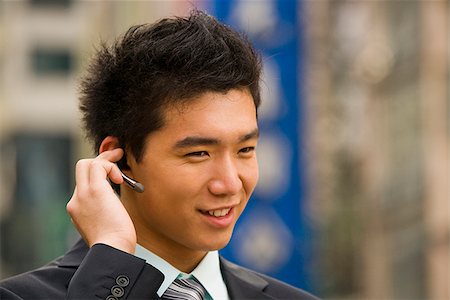 simsearch:640-02949618,k - Man with a cell phone earpiece. Stock Photo - Premium Royalty-Free, Code: 640-02776185
