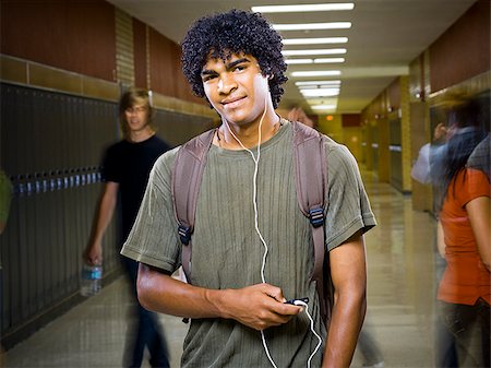 student phone school - High School boy at school listening to MP3 player. Stock Photo - Premium Royalty-Free, Code: 640-02776413