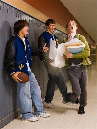 football players bullying nerds - High School Jocks and a Nerd. Stock Photo - Premium Royalty-Free, Code: 640-02776440