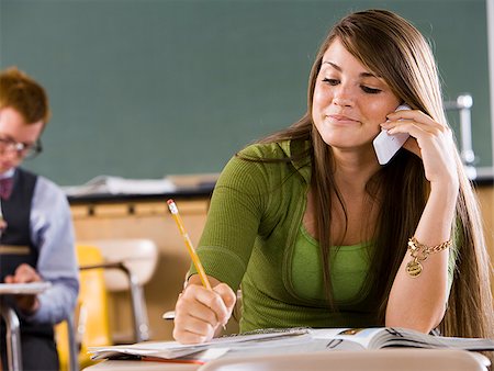 student phone school - Student in a classroom. Stock Photo - Premium Royalty-Free, Code: 640-02776514