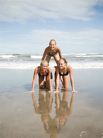 Human pyramid on the beach. Stock Photo - Premium Royalty-Free, Code: 640-02776598