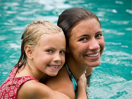 Two girls in a swimming pool. Stock Photo - Premium Royalty-Free, Code: 640-02776689