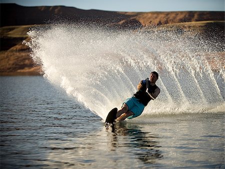 sci d'acqua - Man on a water ski. Fotografie stock - Premium Royalty-Free, Codice: 640-02776715