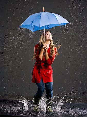 Young woman with an umbrella. Stock Photo - Premium Royalty-Free, Code: 640-02777182