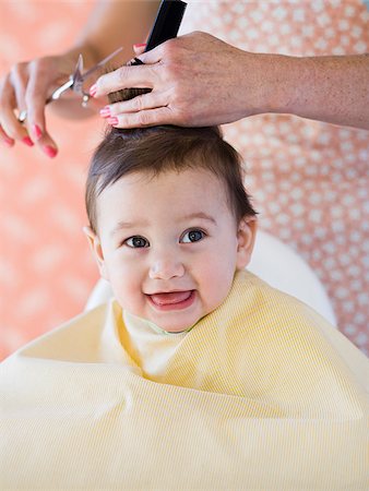 Baby getting a haircut. Stock Photo - Premium Royalty-Free, Code: 640-02777379