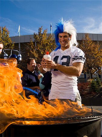 fan and food - tailgate party before a football game Stock Photo - Premium Royalty-Free, Code: 640-02777648