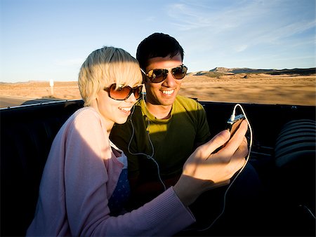 man and woman next to a red convertible Stock Photo - Premium Royalty-Free, Code: 640-02777640