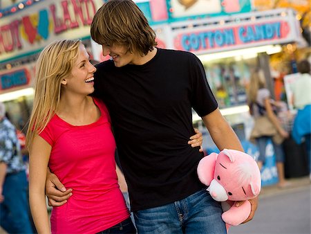 young couple at an amusement park Stock Photo - Premium Royalty-Free, Code: 640-02777765