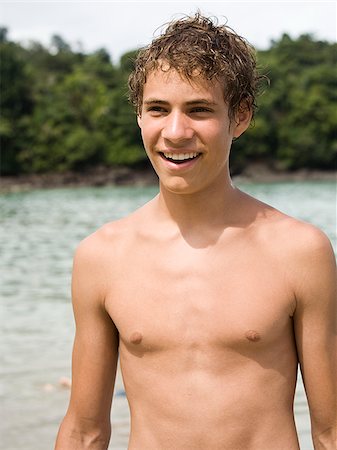 young man at the beach Stock Photo - Premium Royalty-Free, Code: 640-02777787