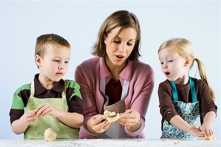 mother cooking with children Stock Photo - Premium Royalty-Free, Code: 640-02777876
