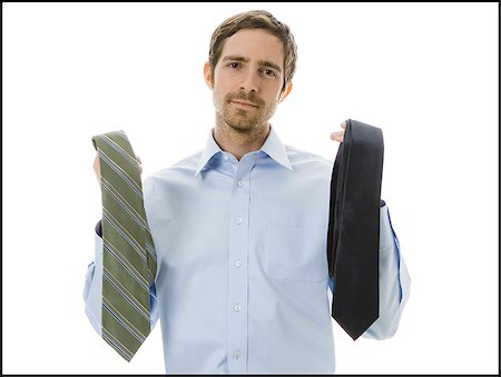 man choosing a tie Stock Photo - Premium Royalty-Free, Code: 640-02778204