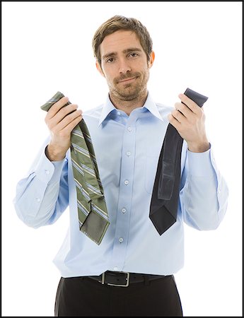 man choosing a tie Stock Photo - Premium Royalty-Free, Code: 640-02778205