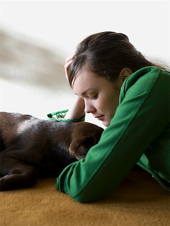 simsearch:640-02658715,k - young woman with a brown puppy Stock Photo - Premium Royalty-Free, Code: 640-02778292