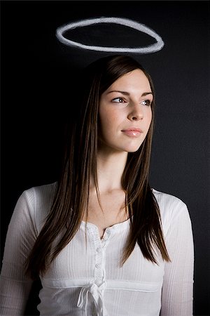 young woman against a chalkboard Stock Photo - Premium Royalty-Free, Code: 640-02778309