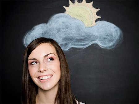 schal - young woman against a chalkboard Stock Photo - Premium Royalty-Free, Code: 640-02778348