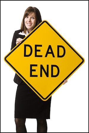 person holding a dead end sign Stock Photo - Premium Royalty-Free, Code: 640-02778406