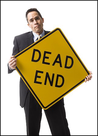 dead end sign - personne tenant une pancarte dead end Photographie de stock - Premium Libres de Droits, Code: 640-02778403