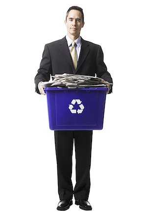 businessperson holding a recycling bin Stock Photo - Premium Royalty-Free, Code: 640-02778411