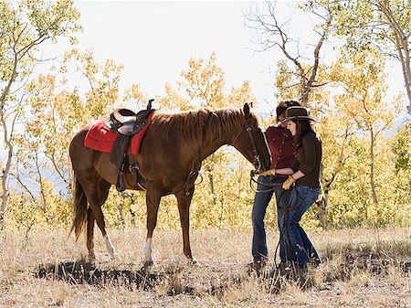 family horses - two women with a horse Stock Photo - Premium Royalty-Free, Code: 640-02778683