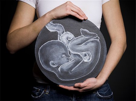 feta - Woman with a drawing of a baby Foto de stock - Sin royalties Premium, Código: 640-02778827