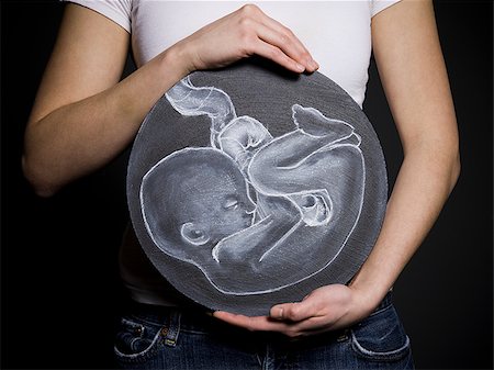 pregnancy illustrations - Woman with a drawing of a baby Foto de stock - Sin royalties Premium, Código: 640-02778827