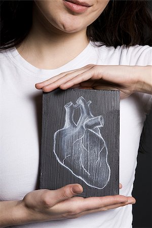 simsearch:640-02658466,k - Woman with a drawing of a heart Stock Photo - Premium Royalty-Free, Code: 640-02778821