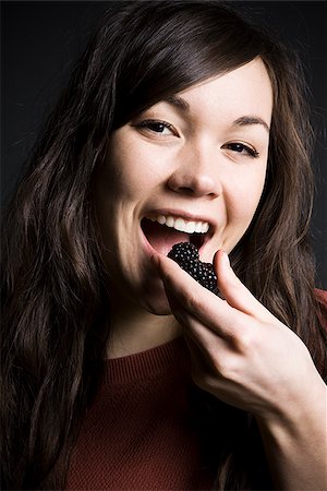 simsearch:640-02952966,k - Woman eating Stock Photo - Premium Royalty-Free, Code: 640-02778834