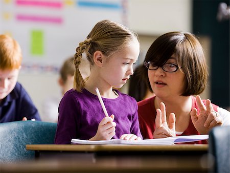 student portrait teacher not smiling - teacher in a classroom Stock Photo - Premium Royalty-Free, Code: 640-02778924