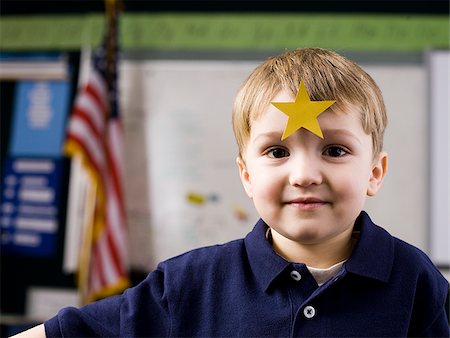 Child and gold star Stock Photos - Page 1 : Masterfile