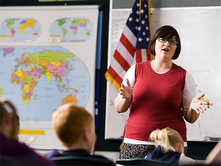 student portrait teacher not smiling - teacher in a classroom Stock Photo - Premium Royalty-Free, Code: 640-02778931