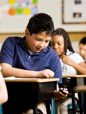 simsearch:640-02658673,k - boy texting in school Stock Photo - Premium Royalty-Free, Code: 640-02778954