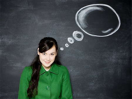 people and speech bubbles - woman in front of a chalkboard Stock Photo - Premium Royalty-Free, Code: 640-02778962