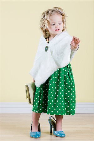 little girl playing dress up Stock Photo - Premium Royalty-Free, Code: 640-02779073