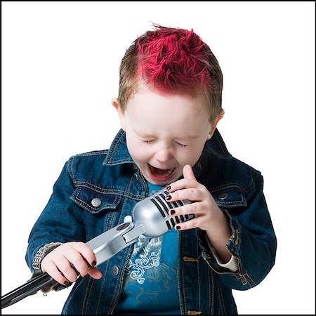 rocks square - little boy singing into a microphone Stock Photo - Premium Royalty-Free, Code: 640-02779090