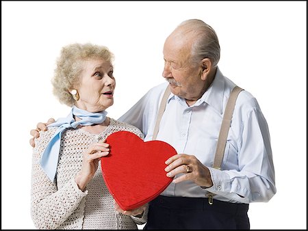 simsearch:640-01362854,k - Older man giving wife Valentines chocolate Stock Photo - Premium Royalty-Free, Code: 640-02770012